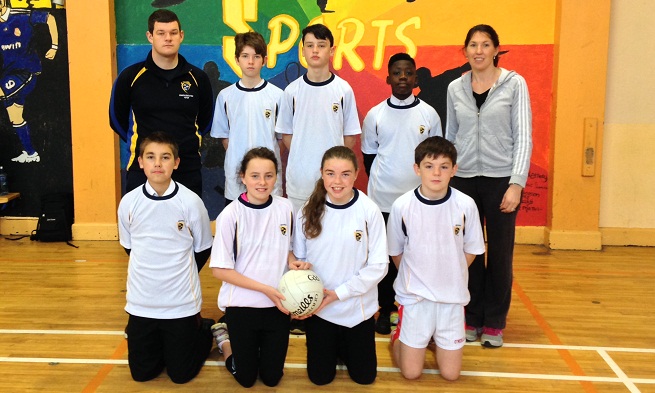 Clare GAA Coach Eoin Murray presented a set of jerseys to the winners of the First Year Super Touch Gaelic Football Blitz at Ennis Community College and Gaelcholáiste an Chláir last week. Also pictured is PE teacher Ms Hilda O'Connell.